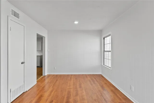 a view of an empty room and window