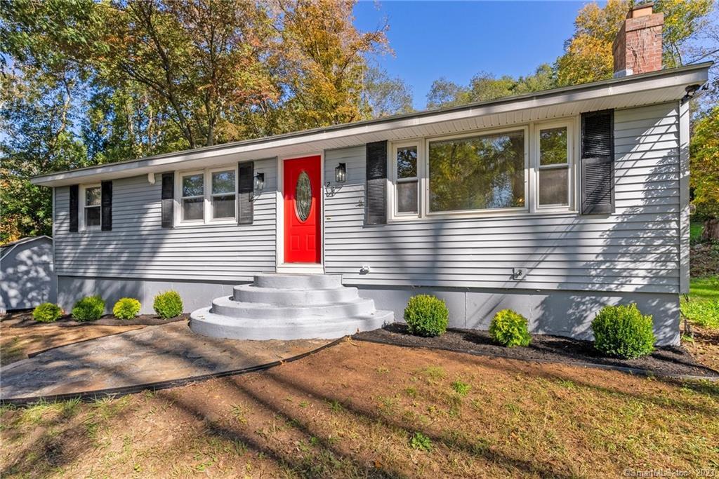 a front view of a house with a yard