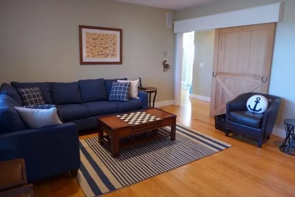 a living room with furniture and a rug