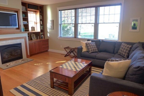 99 Pond Road West Tisbury, MA 02568 - Photo 14 of 39 a living room with furniture and a fireplace