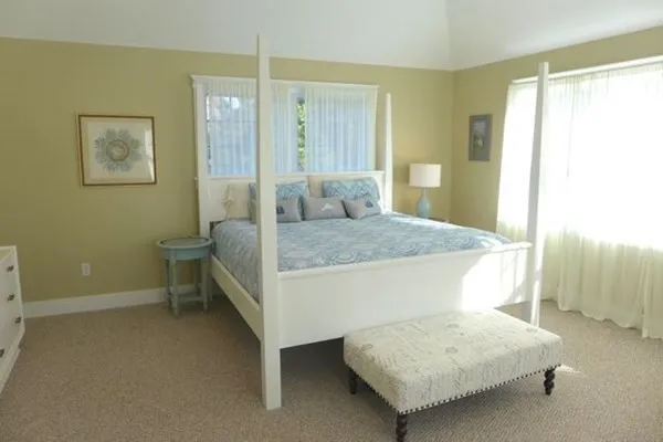 a bedroom with a bed and a table in it