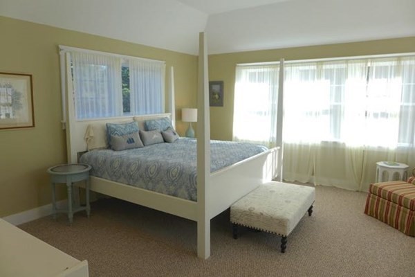 99 Pond Road West Tisbury, MA 02568 - Photo 18 of 39 a living room with furniture and a lamp