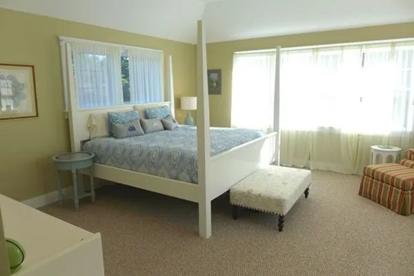 a bedroom with a bed and a table in it