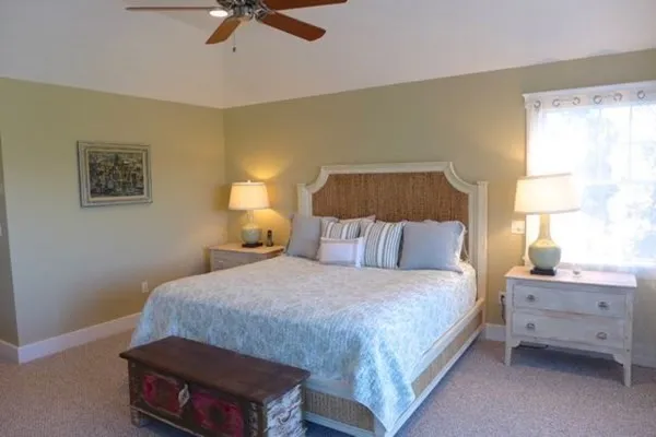 a bedroom with a bed and dresser