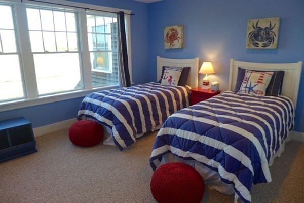 99 Pond Road West Tisbury, MA 02568 - Photo 24 of 39 a bedroom with two beds and next to a window
