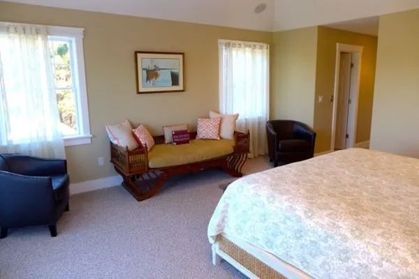 a bedroom with bed and window