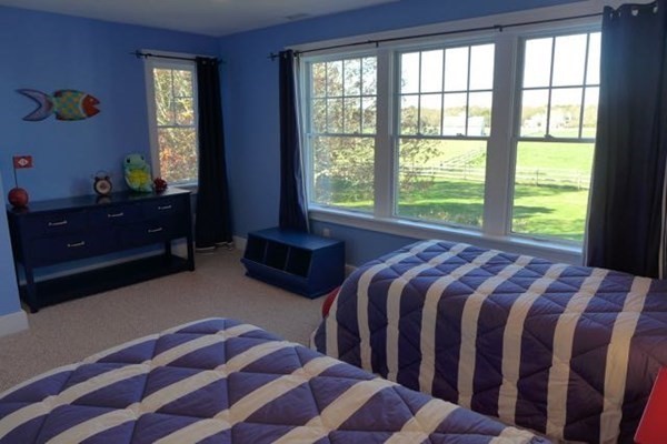 99 Pond Road West Tisbury, MA 02568 - Photo 31 of 39 a bedroom with two beds and a window