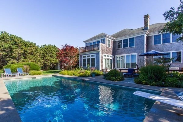 99 Pond Road West Tisbury, MA 02568 - Photo 35 of 39 a view of a house with swimming pool and a yard