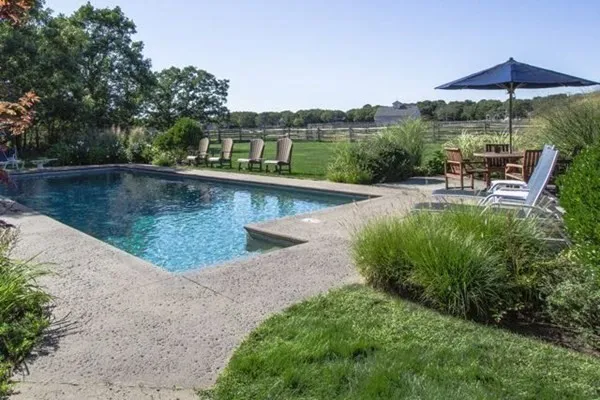a view of a swimming pool with a patio