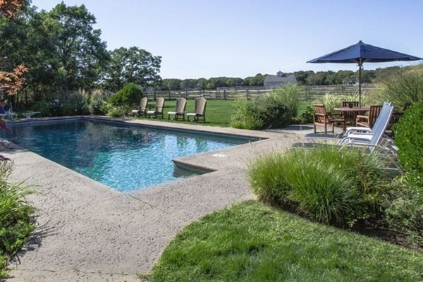99 Pond Road West Tisbury, MA 02568 - Photo 36 of 39 a view of a swimming pool with a patio