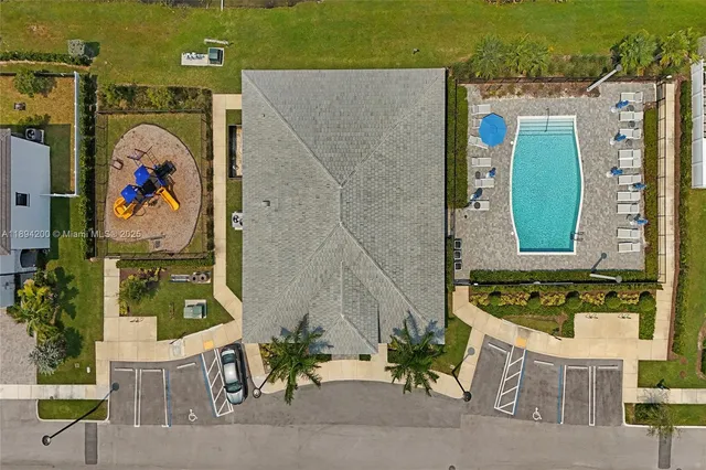 a bedroom with two beds and a window