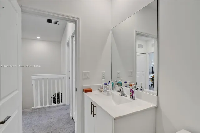 a bedroom with a bed and a table in it