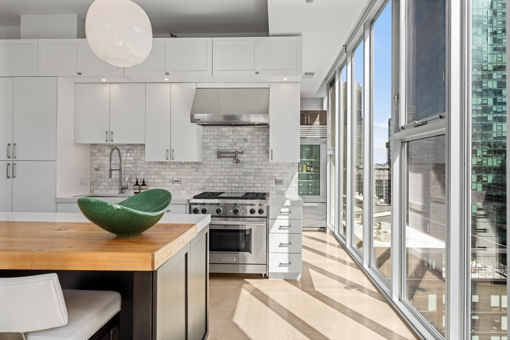 550 North St Clair Street, Unit 2502 Chicago, IL 60611 - Photo 12 of 53 a kitchen with a stove and a sink