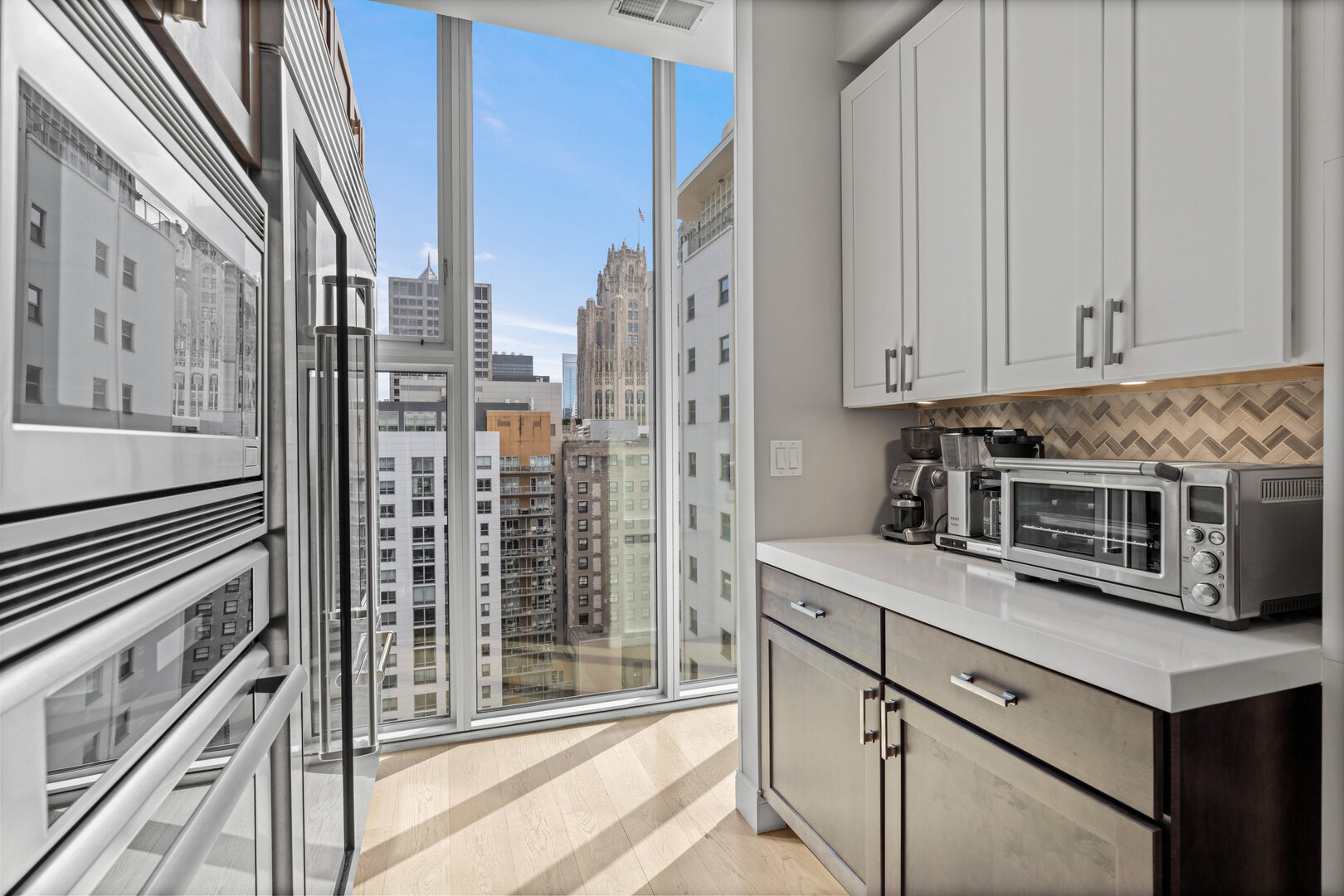 550 North St Clair Street, Unit 2502 Chicago, IL 60611 - Photo 14 of 53 a kitchen with stainless steel appliances granite countertop a granite counter tops and a view of living room