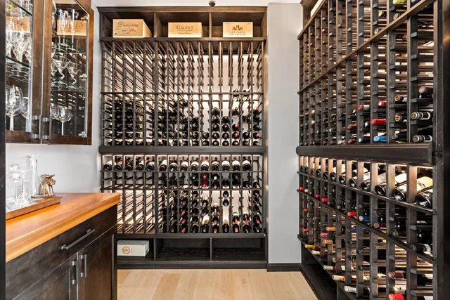 a living room with furniture and a kitchen view