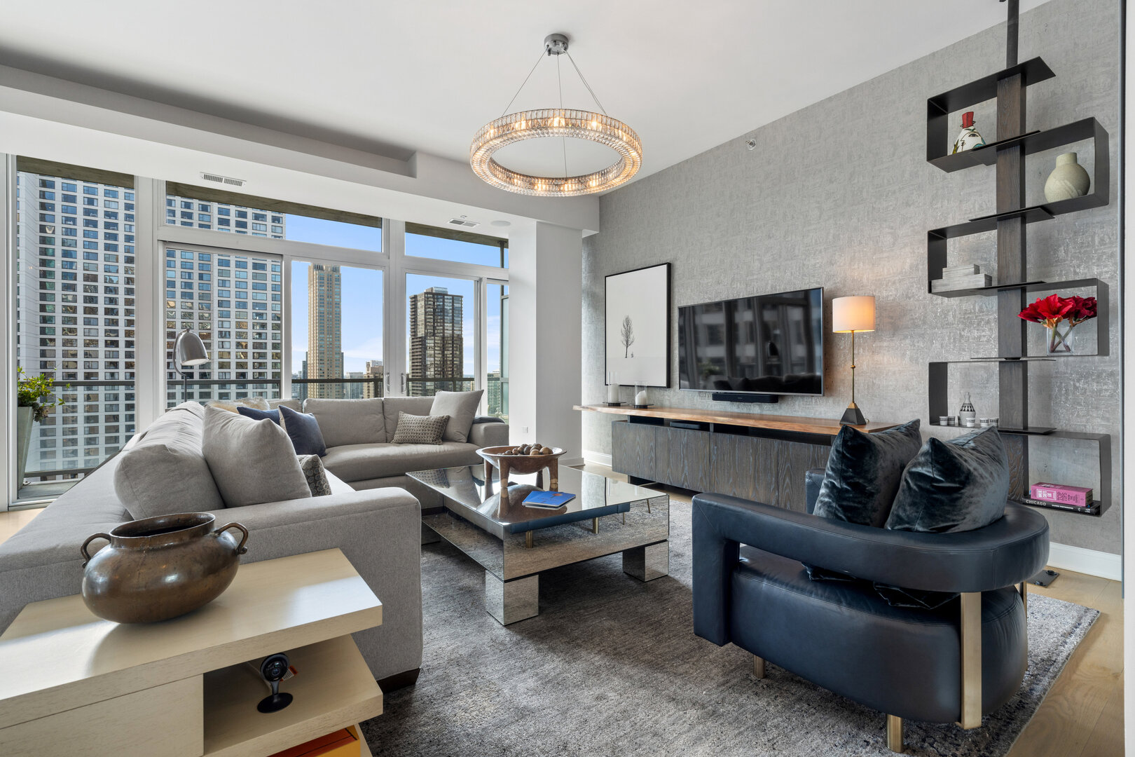 550 North St Clair Street, Unit 2502 Chicago, IL 60611 - Photo 2 of 53 a living room with furniture and a flat screen tv