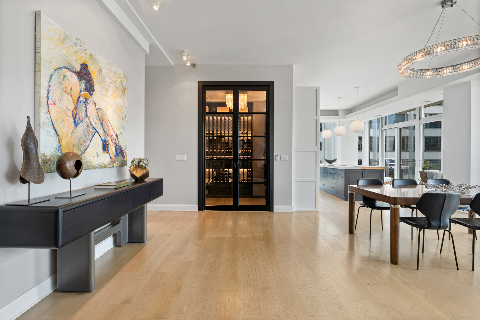 550 North St Clair Street, Unit 2502 Chicago, IL 60611 - Photo 22 of 53 a view of a dining room with furniture and a floor to ceiling window