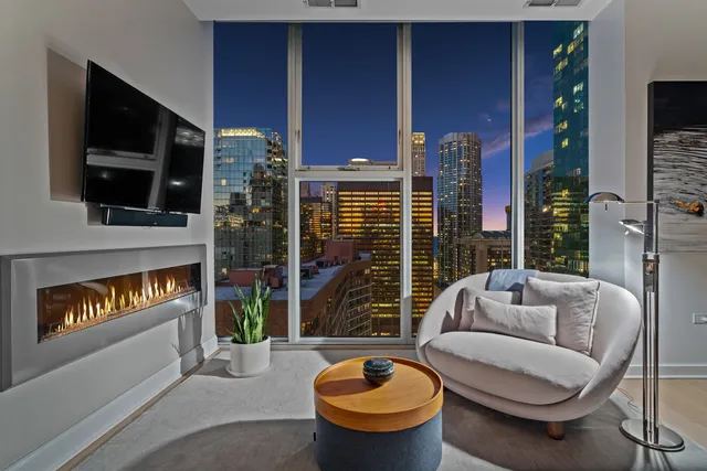 a bedroom with a large bed and a large window