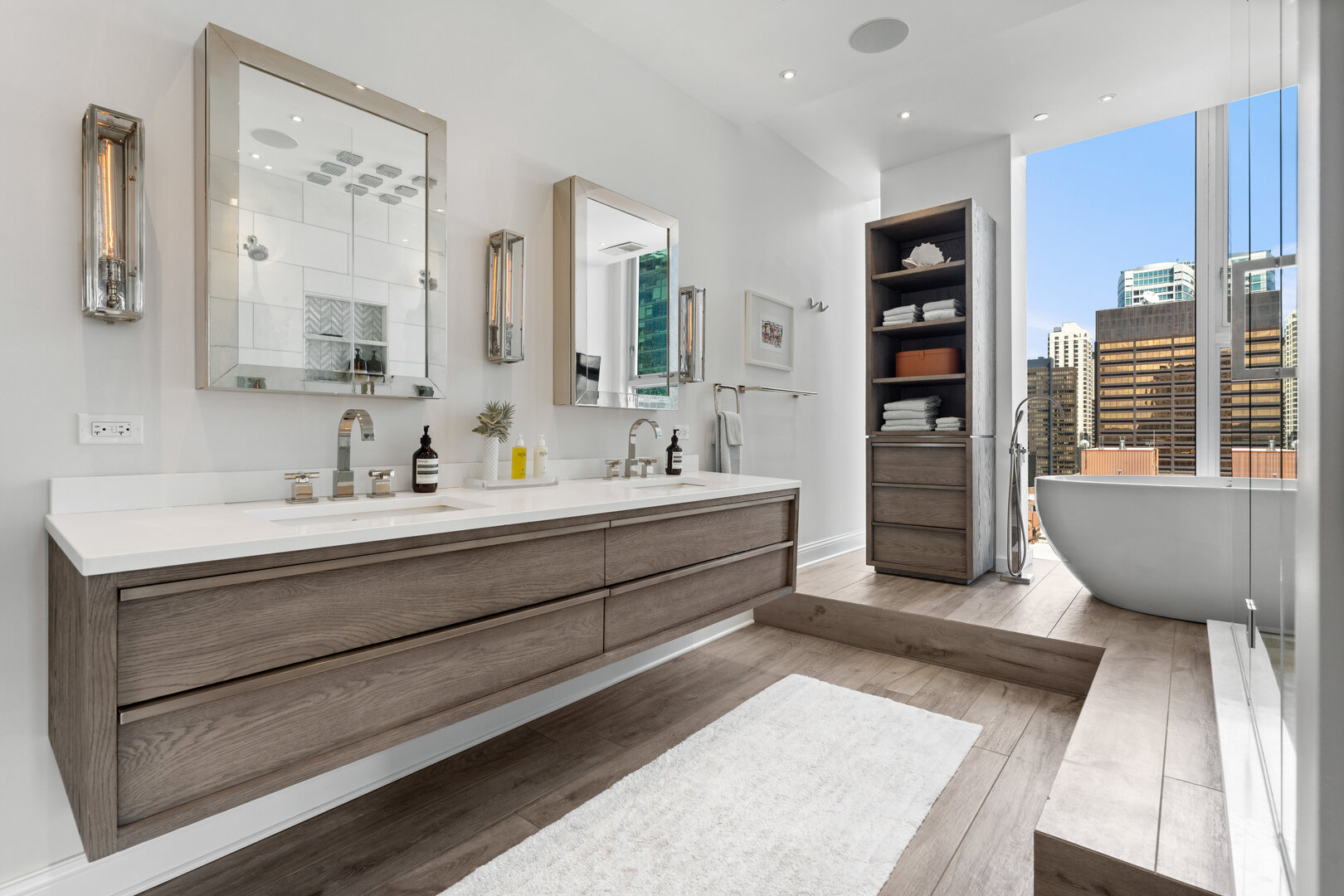550 North St Clair Street, Unit 2502 Chicago, IL 60611 - Photo 30 of 53 a bathroom with a double vanity sink a mirror and a bathtub