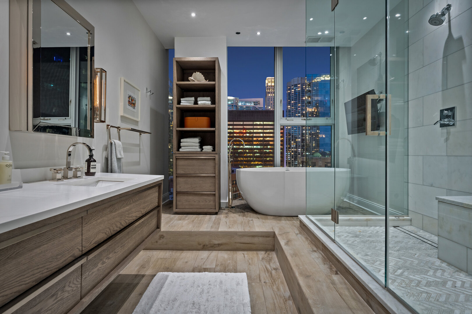 550 North St Clair Street, Unit 2502 Chicago, IL 60611 - Photo 31 of 53 a bathroom with a bathtub and a shower