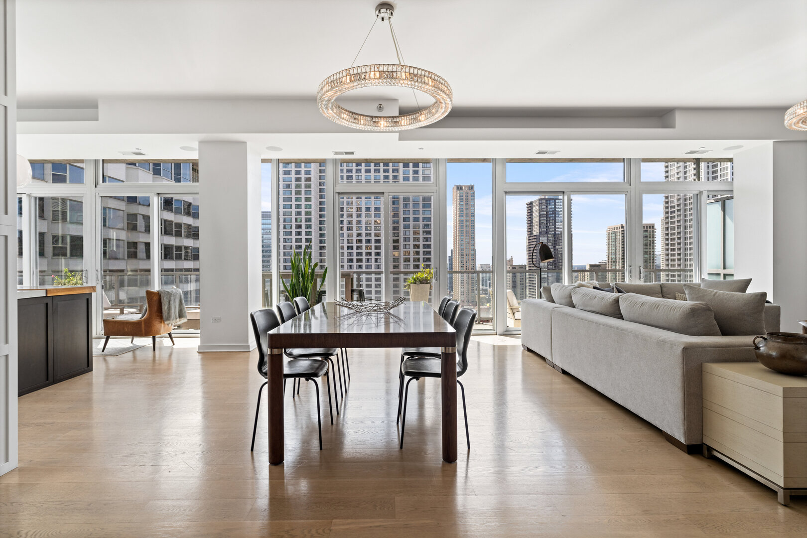 550 North St Clair Street, Unit 2502 Chicago, IL 60611 - Photo 5 of 53 a living room with furniture wooden floor and floor to ceiling windows