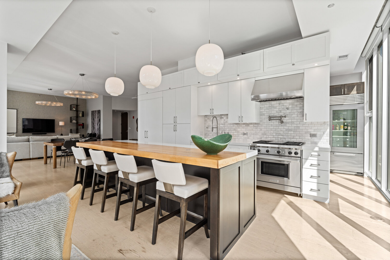 550 North St Clair Street, Unit 2502 Chicago, IL 60611 - Photo 8 of 53 a large kitchen with a table and chairs