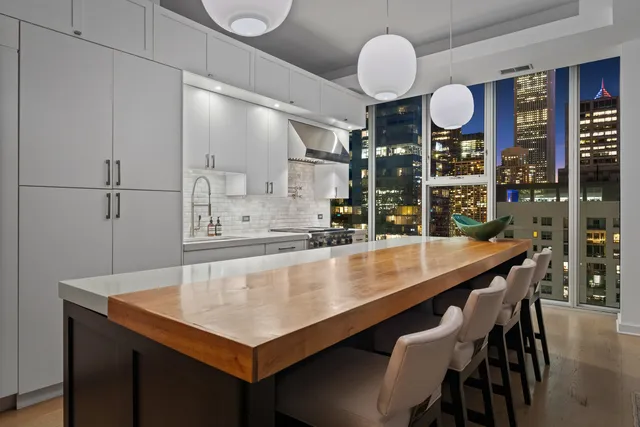 a kitchen with a table and chairs in it