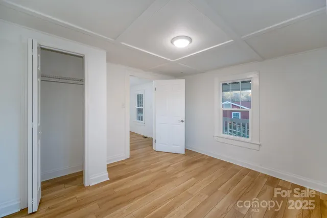 a kitchen with a refrigerator stove and wooden cabinets