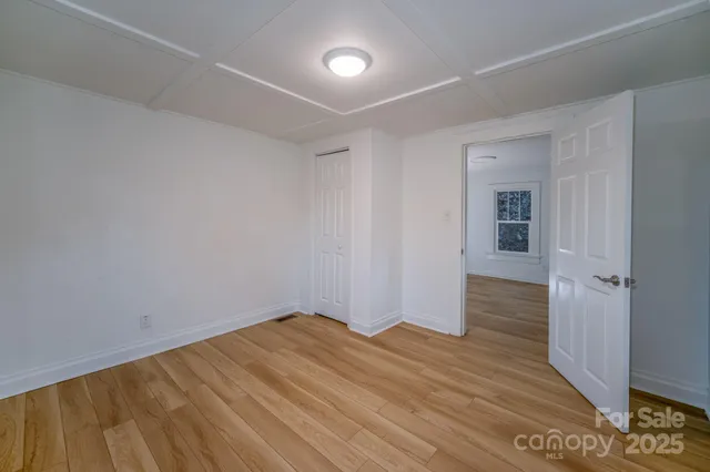 a kitchen with a stove cabinets and a refrigerator