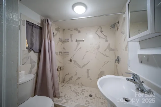 a view of staircase with white walls