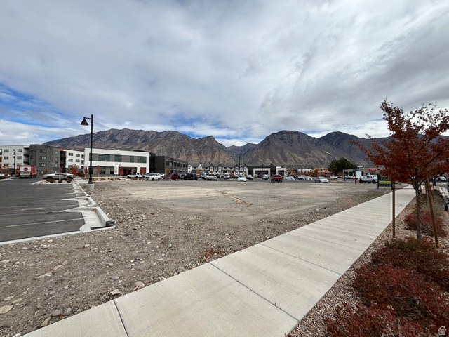 402 West Rivers Edge Drive Provo, UT 84604 - Photo 1 of 4 View of street featuring sidewalks, street lighting, and a mountain view