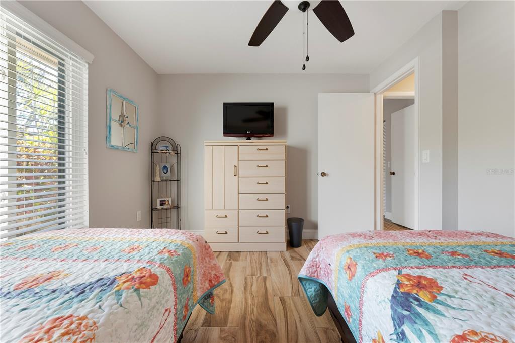 3804 Sun Eagle Lane Bradenton, FL 34210 - Photo 39 of 55 a bedroom with a bed and flat screen tv