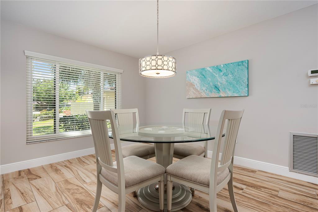 3804 Sun Eagle Lane Bradenton, FL 34210 - Photo 6 of 55 a view of a dining room with furniture window and outside view
