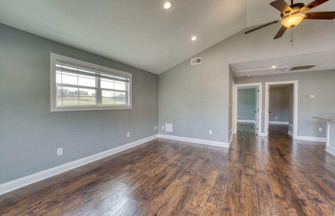 807 Clear Creek Road Pulaski, TN 38478 - Photo 8 of 17 wooden floor in an empty room with a window