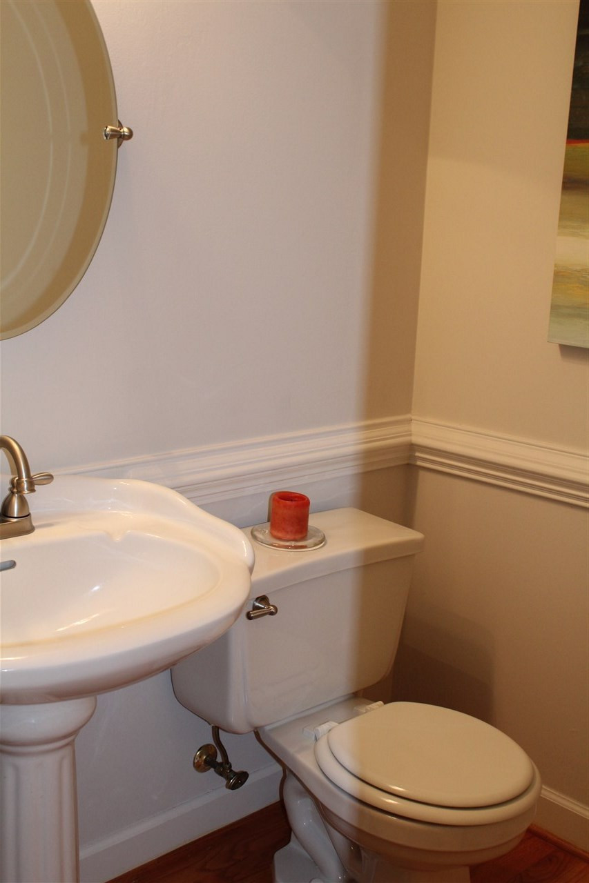 4124 Ridgebrook Bluffs Drive Raleigh, NC 27603 - Photo 10 of 24 First floor powder room. New faucet and lighting. Bathroom