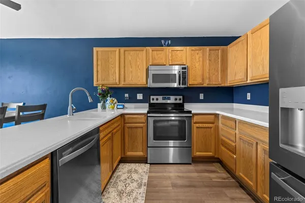 a kitchen with stainless steel appliances a sink cabinets and a counter top space