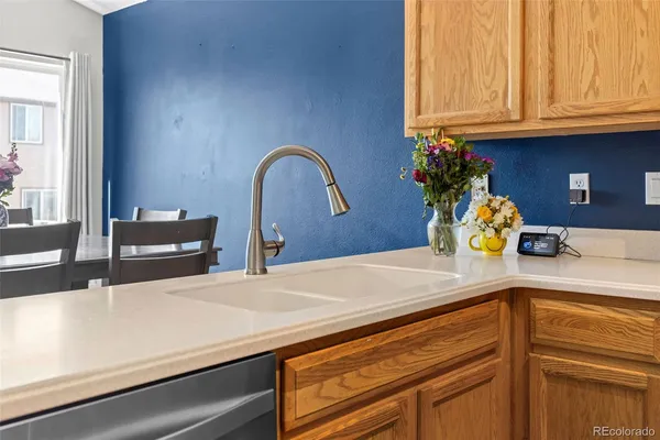 a kitchen with stainless steel appliances a sink and cabinets