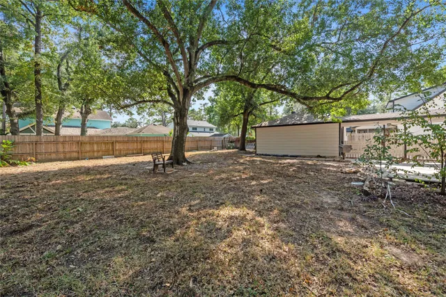 a view of backyard with green space