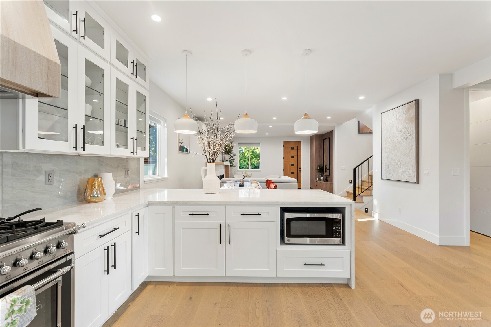 509 North 78th Street Seattle, WA 98103 - Photo 13 of 37 a kitchen with a sink a stove and cabinets