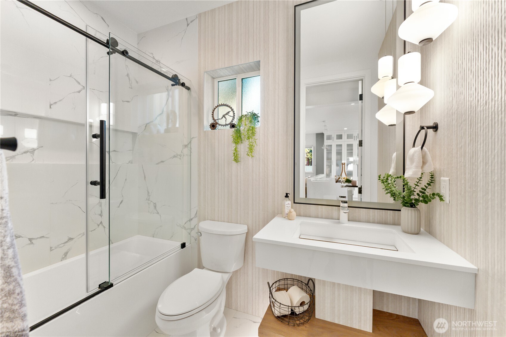 509 North 78th Street Seattle, WA 98103 - Photo 16 of 37 a bathroom with a sink a toilet and shower