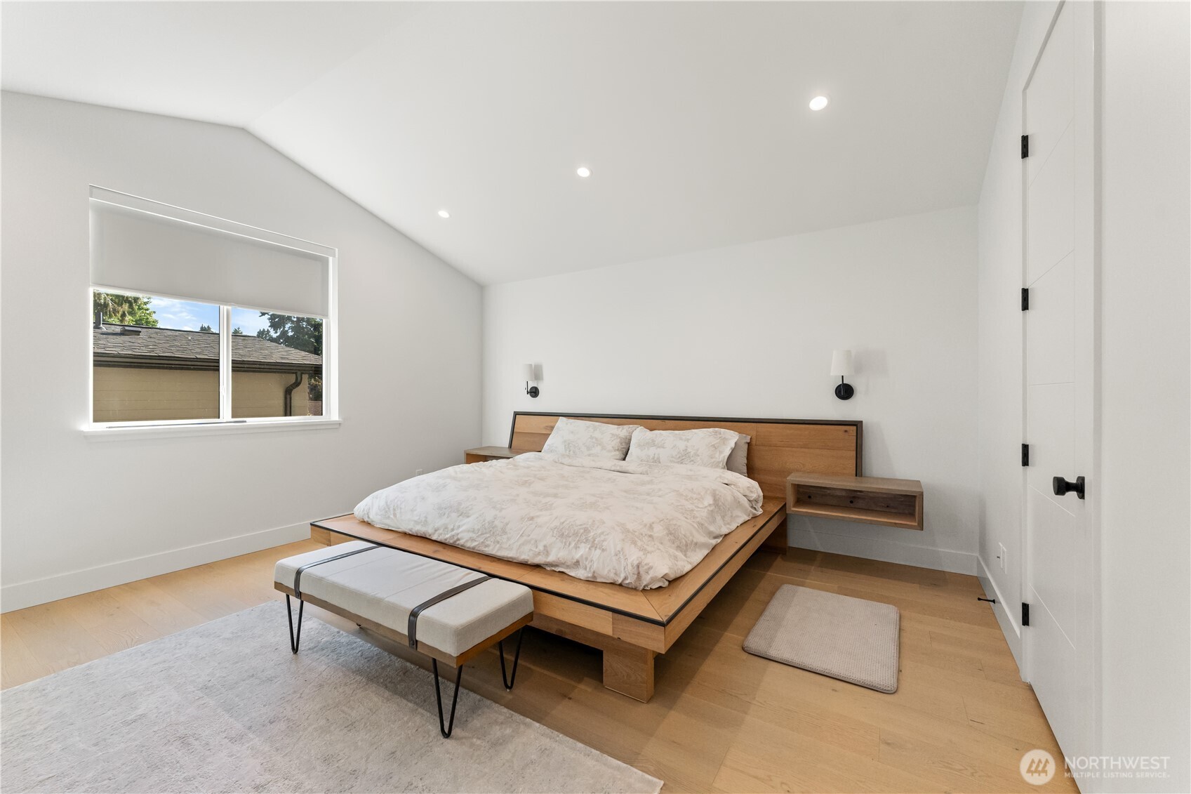 509 North 78th Street Seattle, WA 98103 - Photo 19 of 37 a bed room with a bed and a table