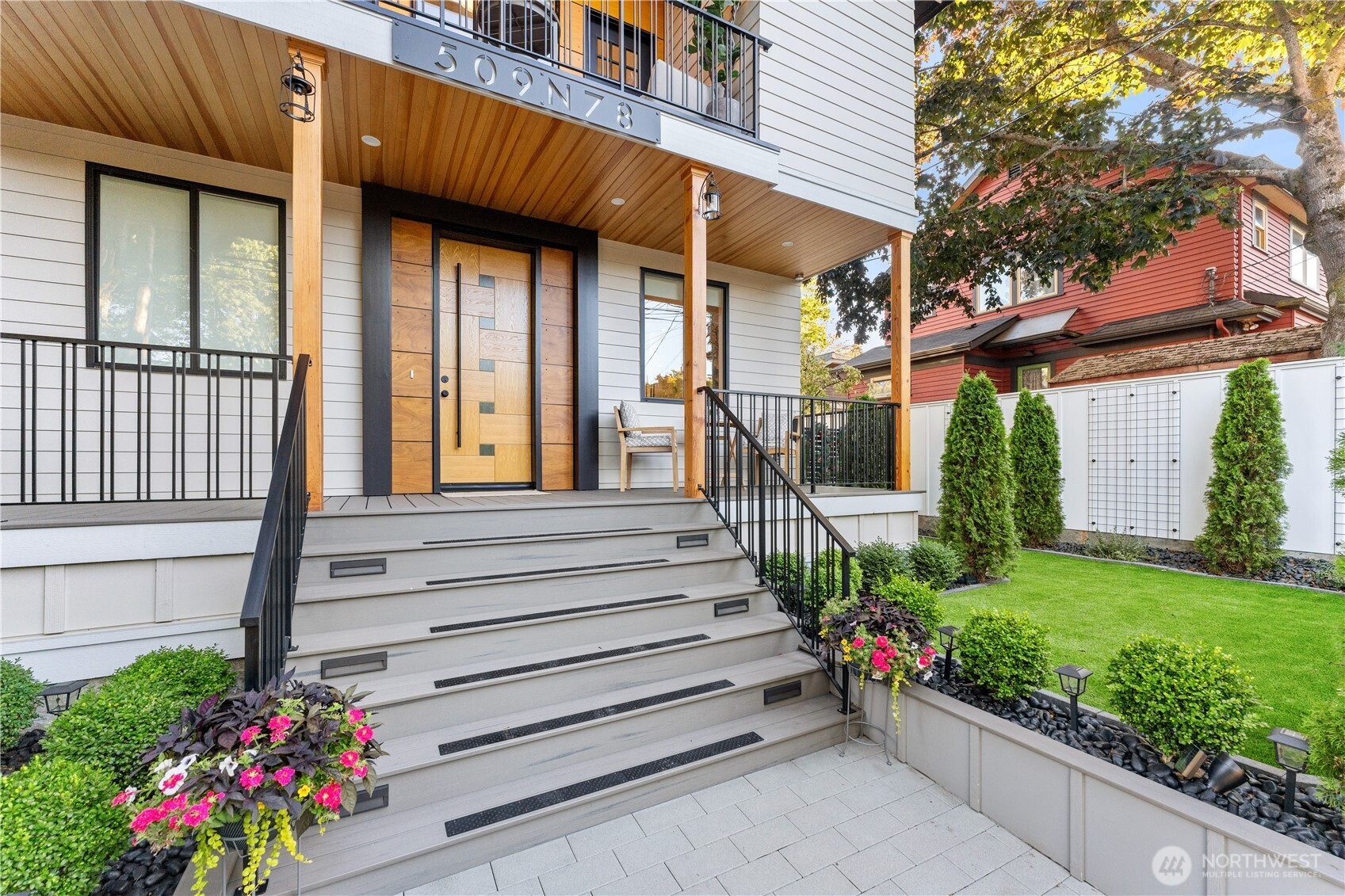 509 North 78th Street Seattle, WA 98103 - Photo 2 of 37 a view of a house with a flower garden