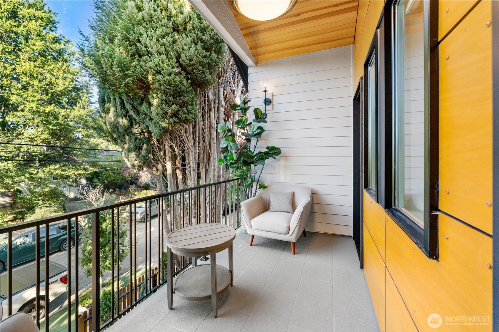 509 North 78th Street Seattle, WA 98103 - Photo 28 of 37 a view of a balcony with chairs