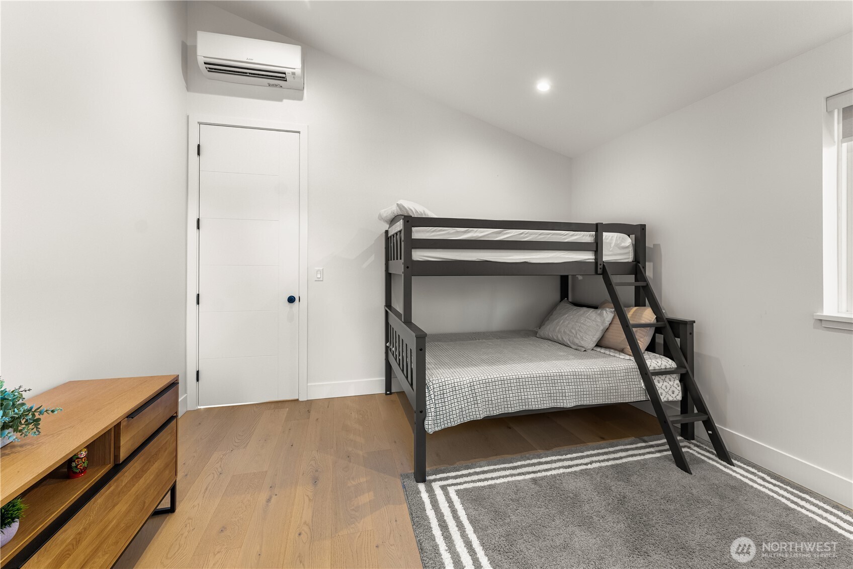 509 North 78th Street Seattle, WA 98103 - Photo 29 of 37 a bedroom with a bed and a dresser