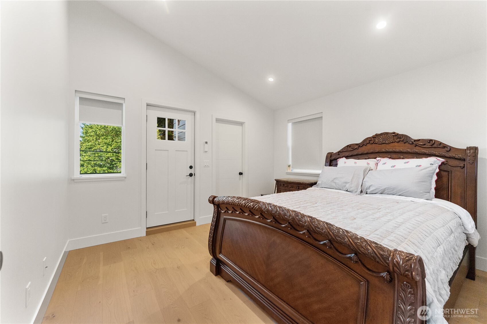 509 North 78th Street Seattle, WA 98103 - Photo 31 of 37 a bedroom with a bed and a window