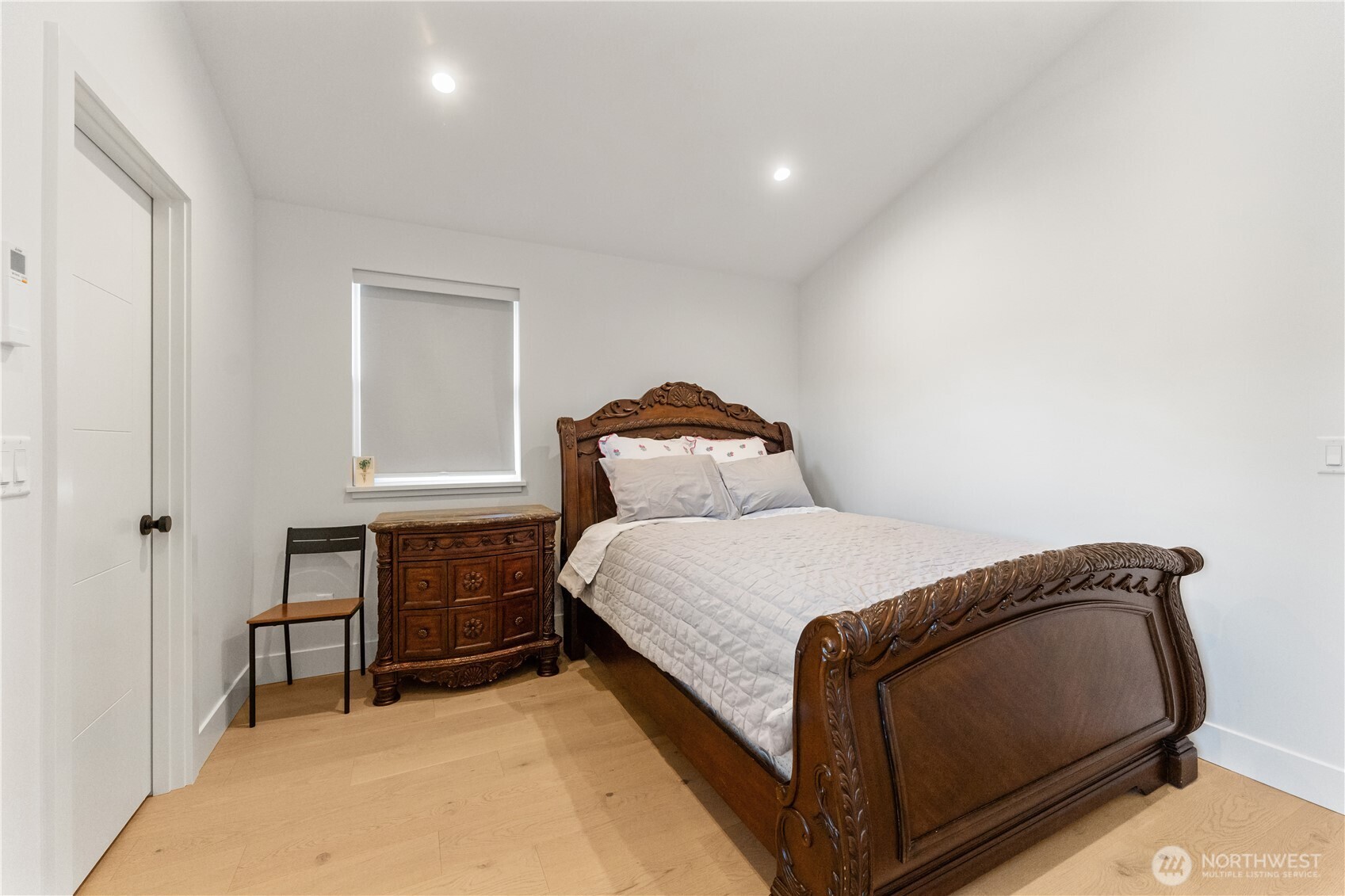 509 North 78th Street Seattle, WA 98103 - Photo 32 of 37 a bedroom with a bed and window