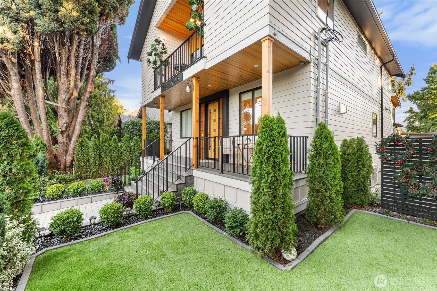 509 North 78th Street Seattle, WA 98103 - Photo 36 of 37 a view of a house with brick walls and a yard with plants