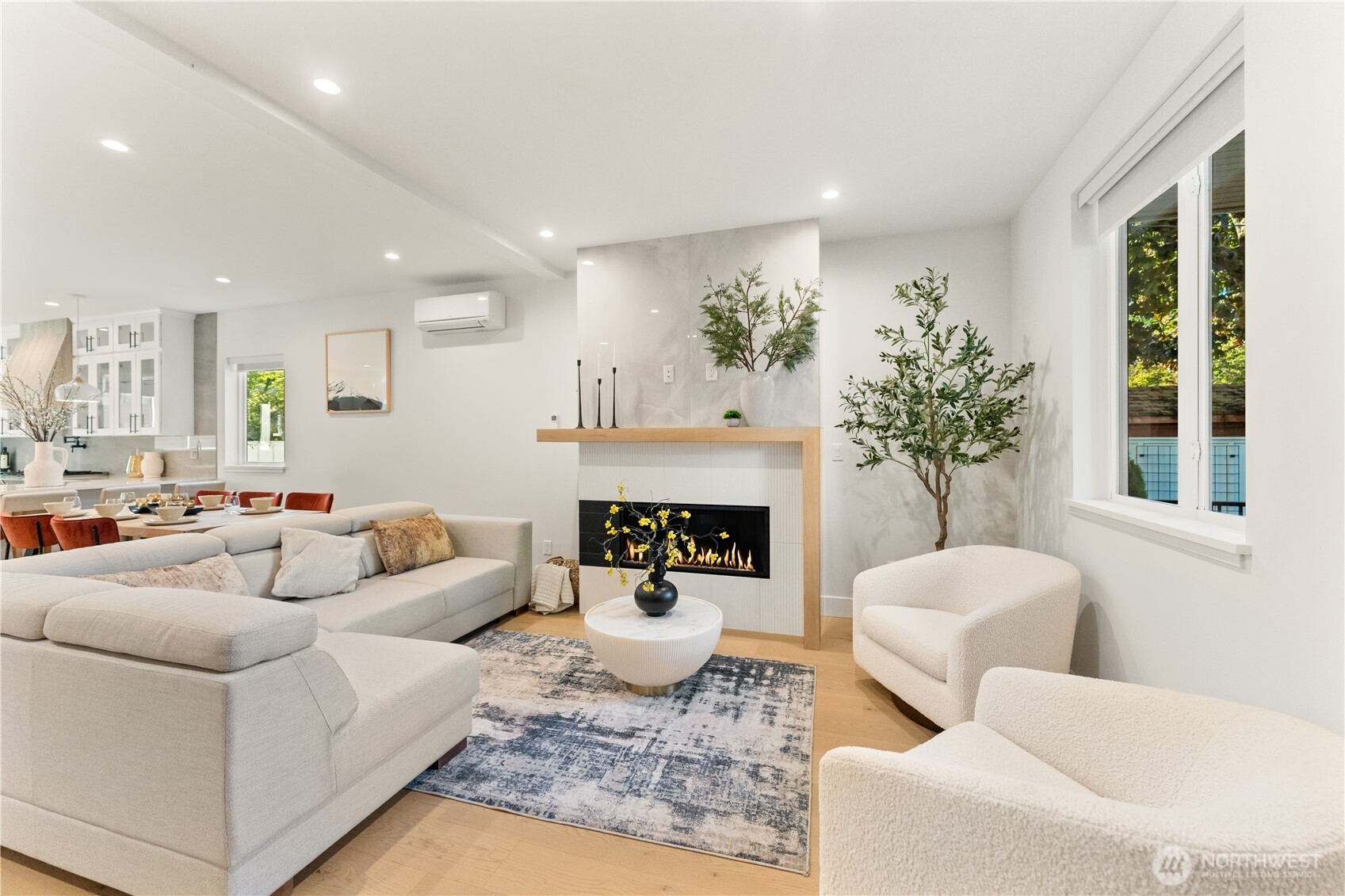 509 North 78th Street Seattle, WA 98103 - Photo 5 of 37 a living room with furniture and a fireplace