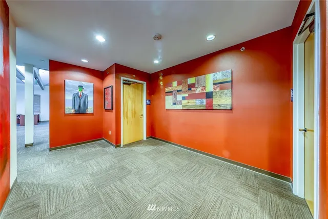 a living room with stainless steel appliances kitchen island granite countertop furniture and a kitchen view