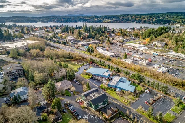 an aerial view of a house with a yard